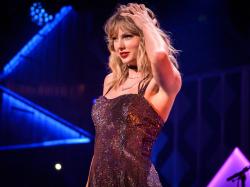  taylor-swift-takes-a-large-bite-out-of-2023-named-apple-musics-artist-of-the-year 