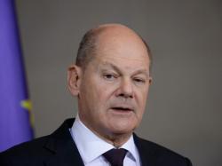  german-chancellor-olaf-scholz-calls-arson-attack-on-teslas-giga-berlin-a-terrorist-act-wants-ev-giants-factory-to-grow-like-fords-93-year-old-cologne-plant 
