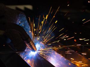 Metal,Welder,Works,With,A,Steel,Welder,In,A,Factory