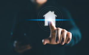 Man touching a digital image of a house