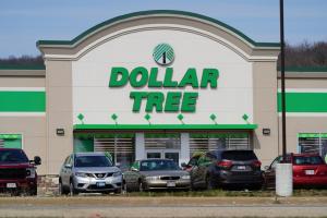 Dollar Tree storefront with parked cars in front.