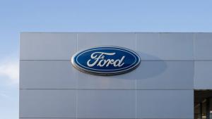 Ford logo on building facade against blue sky