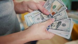 Man holding Dollars