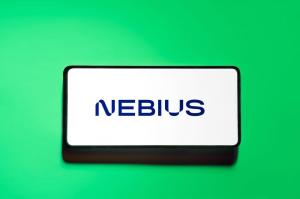 Nebius logo on smartphone screen green background