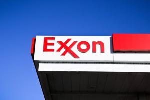 Exxon gas station sign against blue sky