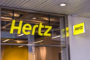 Hertz Sign In Glass Window