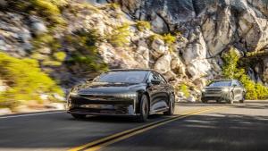 Lucid air vehicles being driven on open road