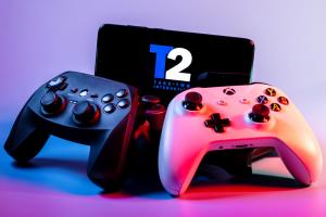 Take-Two Interactive log on table with two gaming modules in front of it