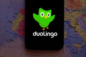 Duolingo Logo On Phone Screen