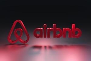 airbnb logo in red floating above ground