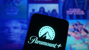 Paramount+ logo on smartphone agains Paramount show images
