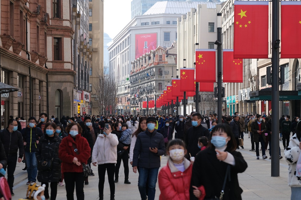 COVID-19 Cases Soar While Stocks Fly: How To Play China's Reopening In The Market