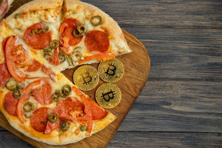 Bitcoin Pizza Week: Crypto Spent On 2 Yummy Pies 14 Years Ago Could Now Buy Jeff Bezos' Yacht And Elon Musk's Jet Fleet — With Spare Change!