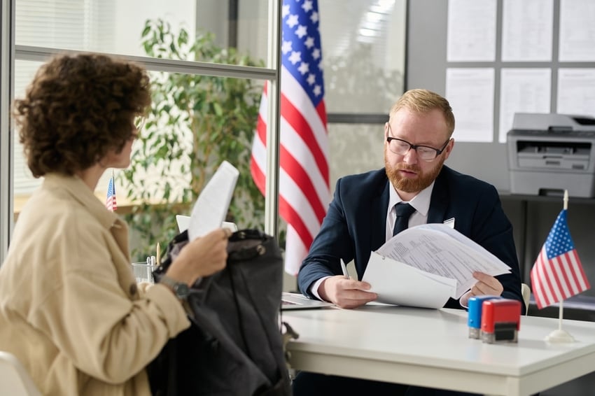 Portrait,Of,Male,Worker,Revising,Documents,Of,Young,Woman,Applying