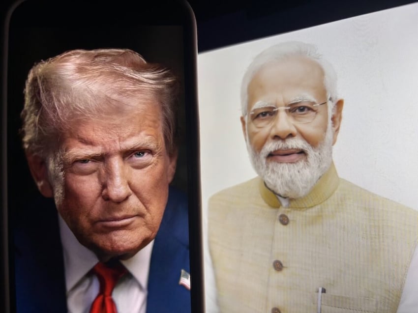 Donald trump on a phone screen in front of Narendra Modi, the prime minister of india