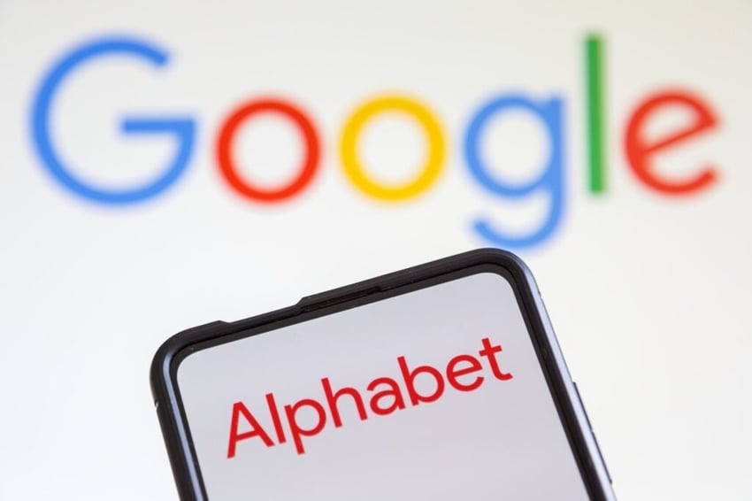 Alphabet displayed on a smartphone screen with the Google logo in the background