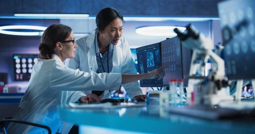 two women in a lab looking at a computer screen