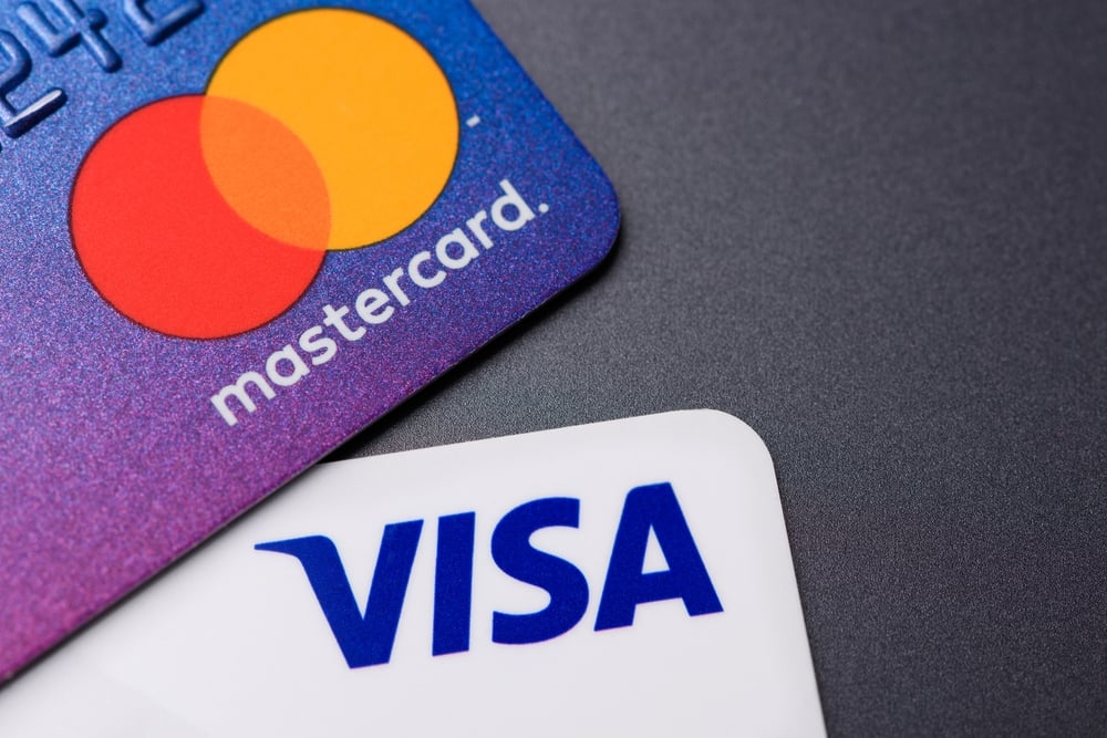 Visa, Mastercard Head Into Earnings With Spending Holding Firm