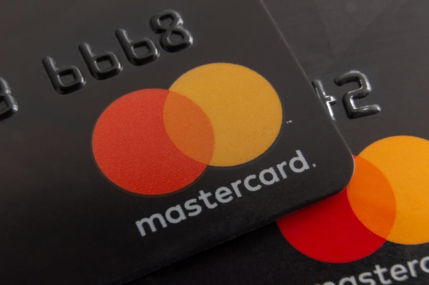 Close-up of Mastercard logos on two credit cards