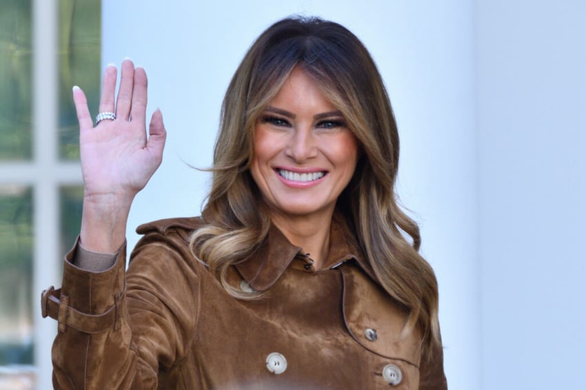 First Lady Melania Trump smiles and waves to the crowd at the end of the Thanksgiving Turkey Pardon ceremony in Rose Garden of the White House.